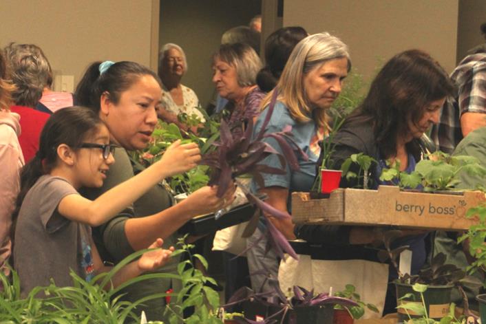 A group of people attending the plant swap.